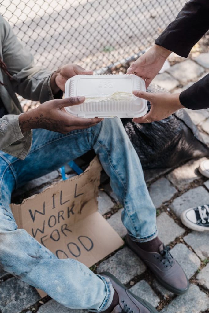 person-giving-alms-to-the-poor-9532273 Person Giving Alms to the Poor